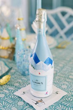 a bottle of champagne sitting on top of a table