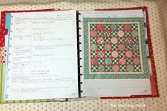 an open planner book on top of a table next to a red and green polka dot covered binder