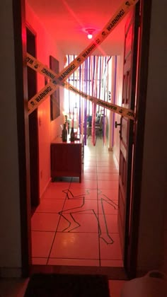 a hallway with caution tape on the floor