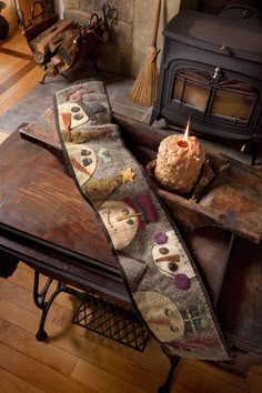 a living room filled with furniture and a fire place next to a table topped with cakes