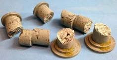 several different types of corks on top of each other with yellow stuff around them