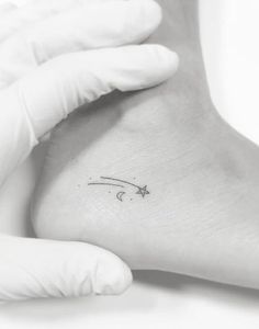 a person with a small tattoo on their foot