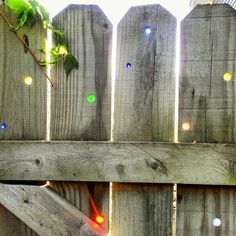 an instagram page with the message love this idea - drill holes in your fence and insert colored marbles