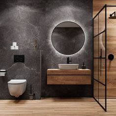 a bathroom with a toilet, sink and mirror in the wall next to a walk in shower