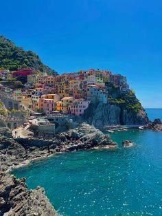 the village is perched on top of a cliff overlooking the ocean