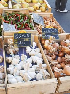 several boxes filled with different types of vegetables