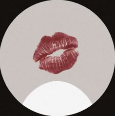 a white circle with red lipstick on it