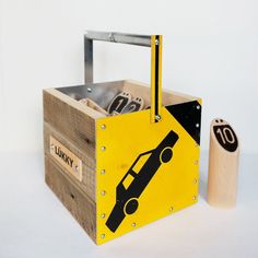 a wooden box with a car sign on it