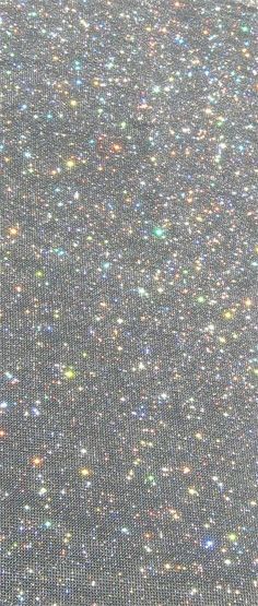 the back side of a computer screen with lots of glitter on it's surface