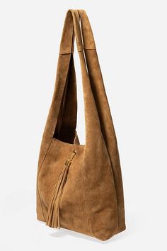 Crafted from 100% rich suede, the Tassel Chain Italian Suede Hobo Bag is perfect for daily use. Featuring a comfortable shoulder strap and wide top opening, this classic hobo style bag is finished with a decorative leather tassel at the front and a hook and eye closure. Pair with relaxed fit jeans and a casual blouse for a classic weekend look. Johnny Was Women's Tassel Chain Italian Suede Hobo Bag in Tan Brown, Leather/Suede Chic Suede Hobo Bag With Leather Handles, Chic Suede Hobo Bag, Chic Suede Hobo Bag With Suede Lining, Chic Leather Hobo Bag With Suede Lining, Chic Suede Hobo Bag For Everyday, Chic Everyday Suede Hobo Bag, Elegant Brown Hobo Bag With Suede Lining, Chic Suede Hobo Bag With Soft Leather, Luxury Suede Hobo Bag With Soft Leather