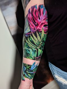 a person with a flower tattoo on their arm