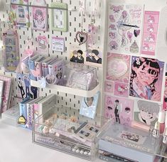 there are many items on display in the store, including pens and magnets for sale