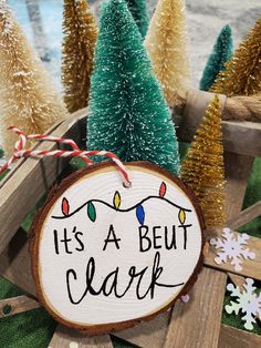 it's a beut clark christmas ornament on wood