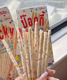 two boxes of lucky toothbrushes with sprinkles on them