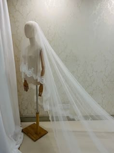 a mannequin with a veil on top of it