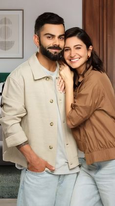 a man and woman standing next to each other