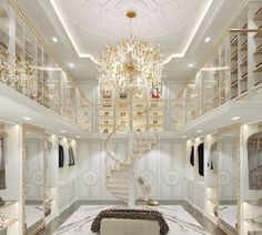 a large white room with chandelier and stairs