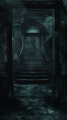 a dark hallway with stairs leading up to the door