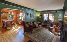 a living room filled with furniture and a fire place