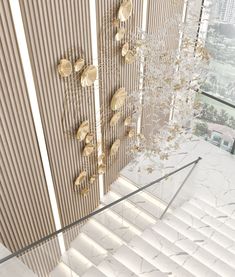 the interior of a modern building with gold leaf decorations