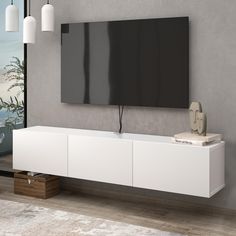 a flat screen tv mounted to the side of a wall