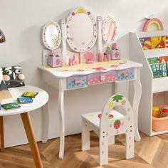 a child's desk and chair with mirrors on the top, toys underneath it