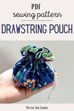 a hand holding a drawstring pouch with the words sewing pattern in front of it