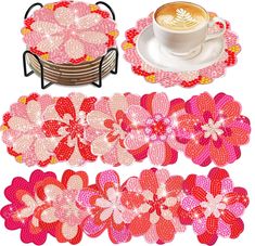 pink and red flower coasters with coffee cup on the plate next to each other