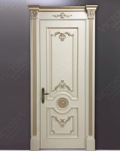 a white door with an ornate design on the front and side panel, against a gray wall