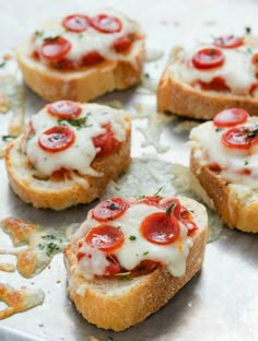 small pieces of bread topped with cheese and pepperoni