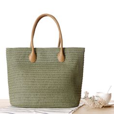 This bag is stylish and very pretty. It is a classic, elegant solid color design.Whether you are out shopping, going to the pool or the beach, this tote bag is the perfect accessory. Spacious enough for carrying any and all of your seaside essentials. Straw Beach Tote, Rattan Handbags, Summer Purses, Straw Beach Bag, Straw Tote Bag, Rattan Bag, Handmade Tote, Top Handle Handbags, Styl Boho