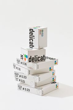 three boxes stacked on top of each other with the word delicat printed on them