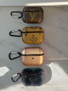 four louis vuitton cases are lined up on the wall