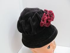 We are offering for sale this vintage (most likely made in the 1950's) velvet, flapper style doll hat. The hat is in black velvet and has 3 burgundy velvet flowers attached to the side. The hat is in very good condition and is not lined. The hat's inside circumference is 13 inches that hat measures from the top to the bottom, 4.5 inches. The piece is in very good condition and comes from a SMOKE FREE home. Velvet Flowers, Flapper Style, Doll Hat, Burgundy Velvet, Doll Clothing, Black Velvet, Doll Toys, Vintage Black, Clothing Items