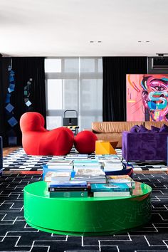 a living room filled with colorful furniture and art