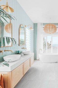 a bathroom with two sinks and a large bathtub in the middle of the room