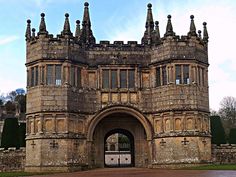 an old stone castle with a gate in the middle