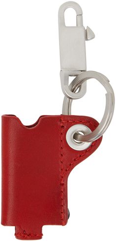 a red leather keychain with a metal hook on the front and side of it