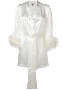 Ivory silk Mia satin robe from Gilda & Pearl featuring long sleeves, a loose fit, a tie waist and ostrich feather embellishments. POSITIVELY CONSCIOUS: Gilda & Pearl scores 3 out 5 by independent ethical brand rating agency Good On You. It has a good animal rating and does not use fur, leather, wool, down, exotic animal skin or angora. It traces most of its supply chain manufactures locally to reduce its carbon footprint. Nightwear Dress, Short Kimono, Silky Dress, Silk Robe, Ann Demeulemeester, Dolce E Gabbana, Luxury Lingerie, Versace Jeans, Night Dress