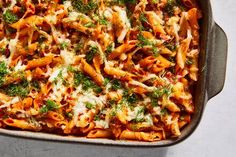 a casserole dish filled with pasta and sauce