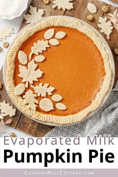 a pumpkin pie with leaves on it and the words evaporated milk pumpkin pie