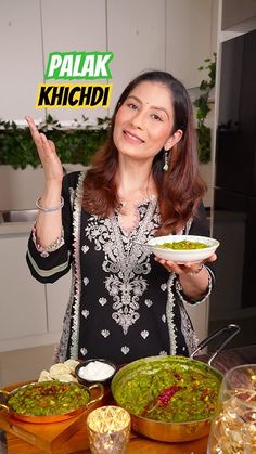 a woman holding a bowl of food in front of two bowls of guacamole