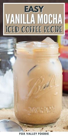 an easy vanilla mocha iced coffee recipe in a mason jar with spoons on the side