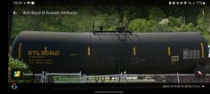 a black train car sitting on top of a track