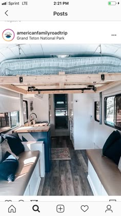 the interior of a camper with couches and kitchen area in it, including a bed