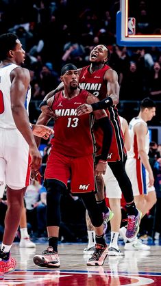 the miami heat are playing basketball in front of an audience