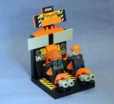 there is a lego man and woman sitting on top of a car with two other people