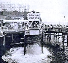 an old black and white photo of people on a boat in the water near a pier