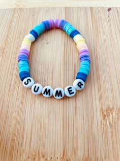 a bracelet with the word summer spelled on it