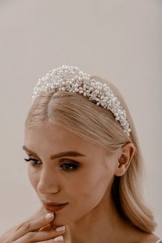 Pearl Regalia Headband Elevate your bridal hairstyle with Pearl Regalia Headband, featuring clear glass and pearls. This accessory adds a touch of timeless elegance to any wedding day look, with delicate detailing that sparkles in the light. Whether you're wearing your hair up or down, this headband is the perfect finishing touch to complete your bridal ensemble. Pearl Bridal Headband With Veil, Elegant Adjustable Bridal Accessories, Beaded Hair Accessories For Wedding, Elegant White Headband Jewelry, Adjustable Pearl Bridal Accessories For Wedding, Pearl White Pearl Bridal Accessories, Silver Pearl Bridal Accessories For Bride, Elegant Adjustable Headband With Structured Crown, Adjustable Beaded Headpiece For Wedding